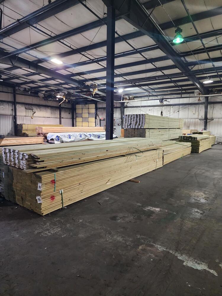 Treated lumber in warehouse.