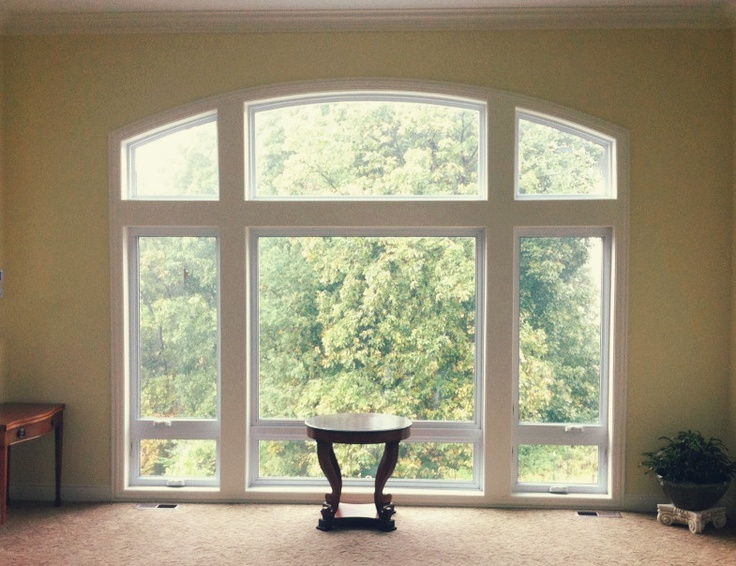 Quaker window with arched top.